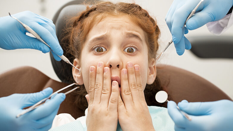 How can the dental team help reduce patient anxiety?