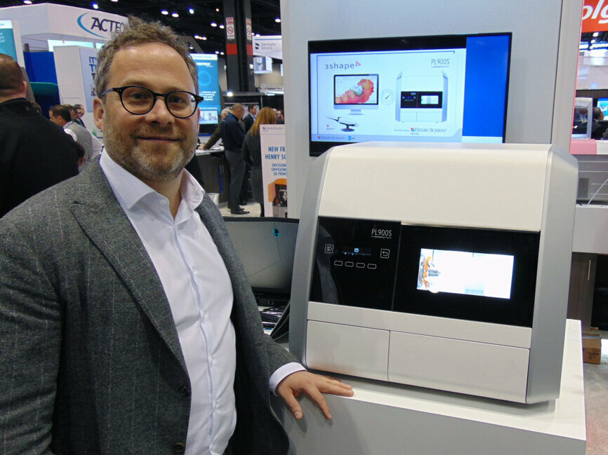 At the Henry Schein booth, Georg Eickhoff shows off the new PL900S mill. 
