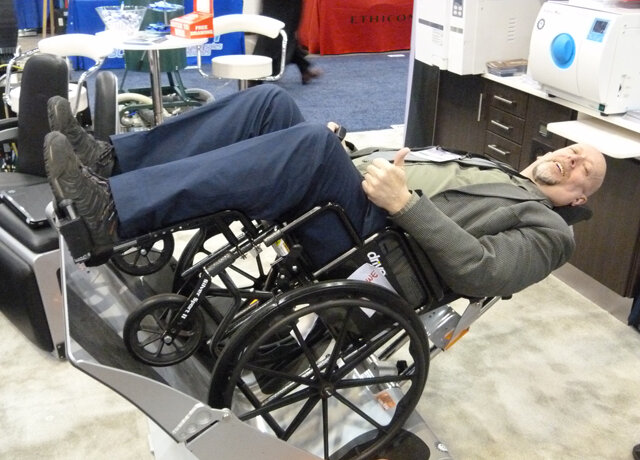 In the Dental Fix Rx booth, John Walters demonstrates his Compact Platform adaptive dental-chair device, which enables a patient to remain in a wheelchair that can be positioned in an ergonomically correct location for the practitioner. This is the first year for the product to be available in Canada.