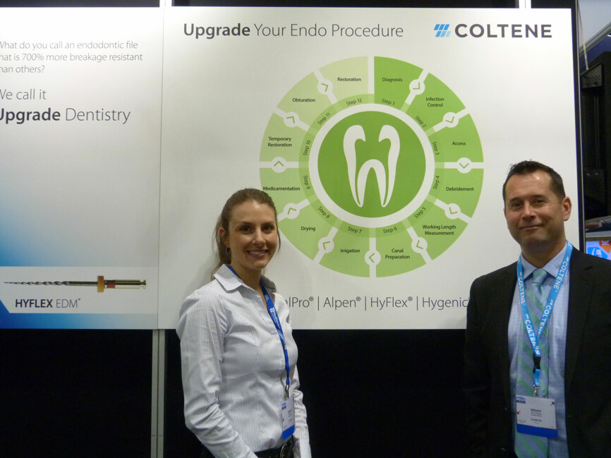 Megan Booth and Brian Kelting with the endo-procedure wheel in the Coltene booth.