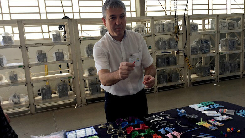 Roger Morelli, industrial director of Morelli, showing one of the 2,000 orthodontic products manufactured by his company.