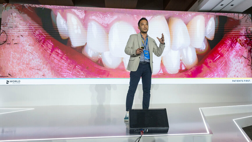 Dr Ricardo Tanaka spoke during the plenary session, taking attendees on a journey through a complete digital flow. (Image: Dentsply Sirona)