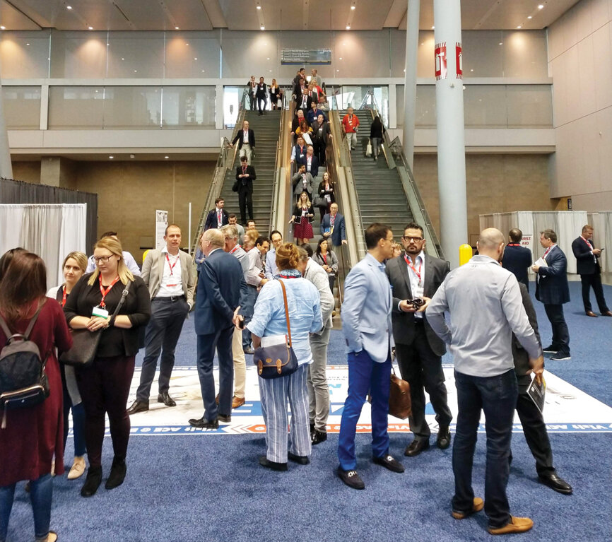 Attendees head down into the exhibit hall to start their day Thursday during the AAOMS Annual Session.