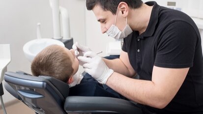 Dentist turns primary teeth black to explore caries management options