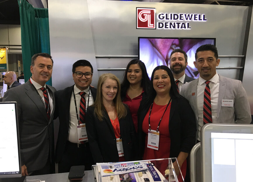 From left in the Glidewell Dental booth are Yannick Gosselin, Kevin Argueta, Jenny Gardner, Suzeanne Harms, Vivianne Pacelli, Jesse Betsill and Fahim Jaan.