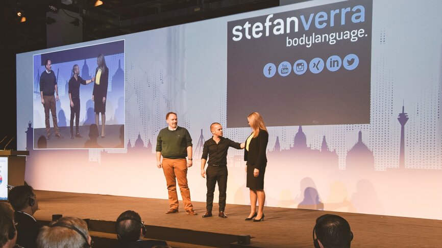 Body-language expert Stefan Verra (middle) coached the audience. (Photographs: Yvonne Bachmann, DTI)