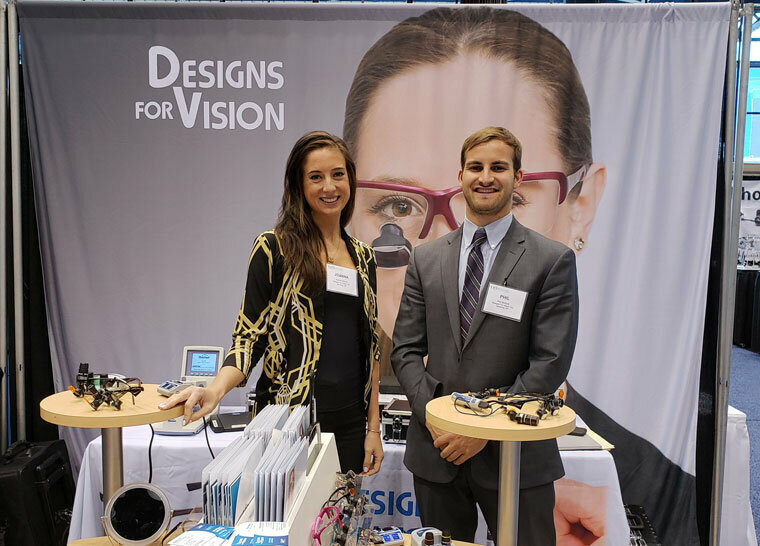 Need to update your loupes and headwear? Stop by the Designs for Vision booth, and get some help from Joanna Sterna and Phil Bullock. (Photograph by Nirmala Singh / Dental Tribune America)