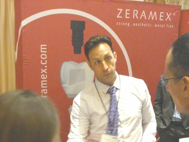 Mike Foley, president the U.S. division of Zeramex, describes the metal-free, all-ceramic implant system to attendees.