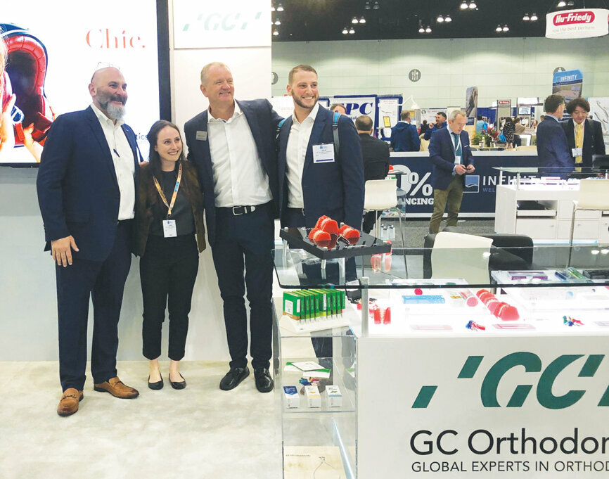 GC Orthodontics America officials take time out for a photo op with attendees.