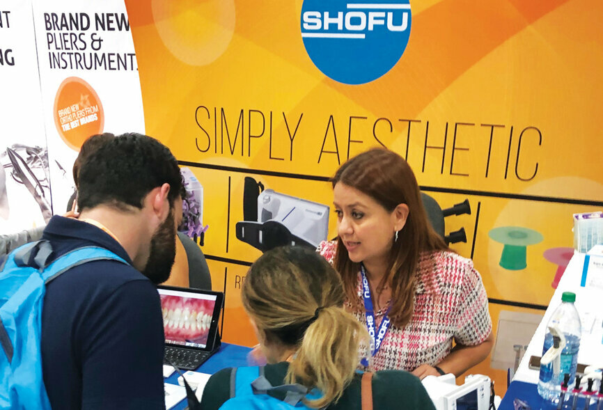 Norma Luna of Shofu Dental Corp. helps attendees make sure they go home with the products they need.