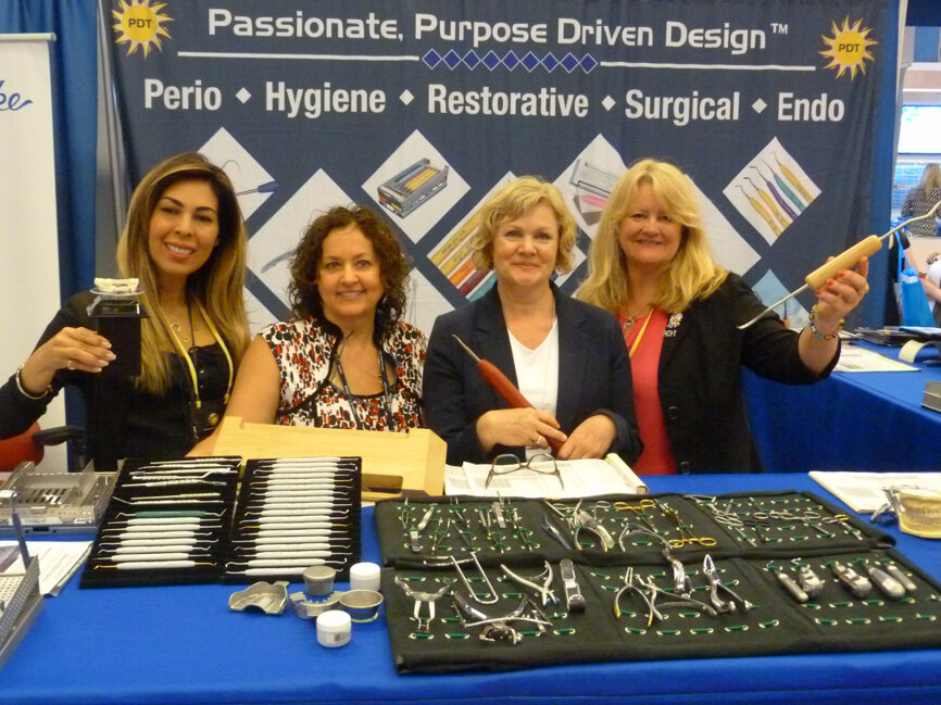 Having fun with the props in the Paradise Dental Technologies booth are, from left, Elaine Steckel, Louisette Boutet, Suzanne Perras and Wendy Birtles.