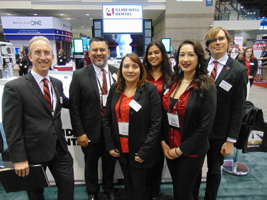 The team members from Glidewell gather for a group photograph at their booth. (Photo: Fred Michmershuizen/Dental Tribune America)