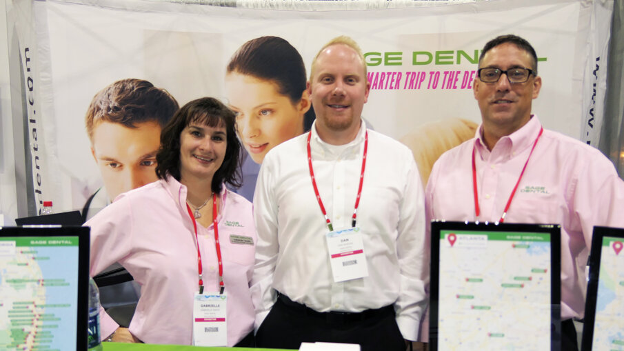 From left: Gabrielle Smith, Dan Norton and Chris Van Tine at the Sage Dental booth.