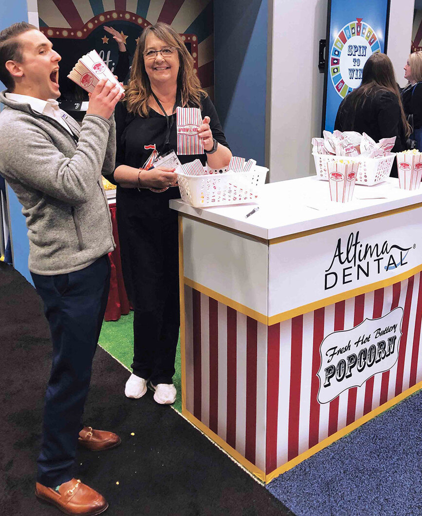 Altima Dental grabs lots of attention with popcorn and its spin-for-a-prize wheel.