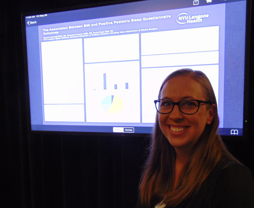 Dr. Krystal Kazemba of NYU Langone Health with her poster presentation on the association between BMI and positive pediatric sleep questionnaire outcomes. (Photo by Fred Michmershuizen/Dental Tribune America)