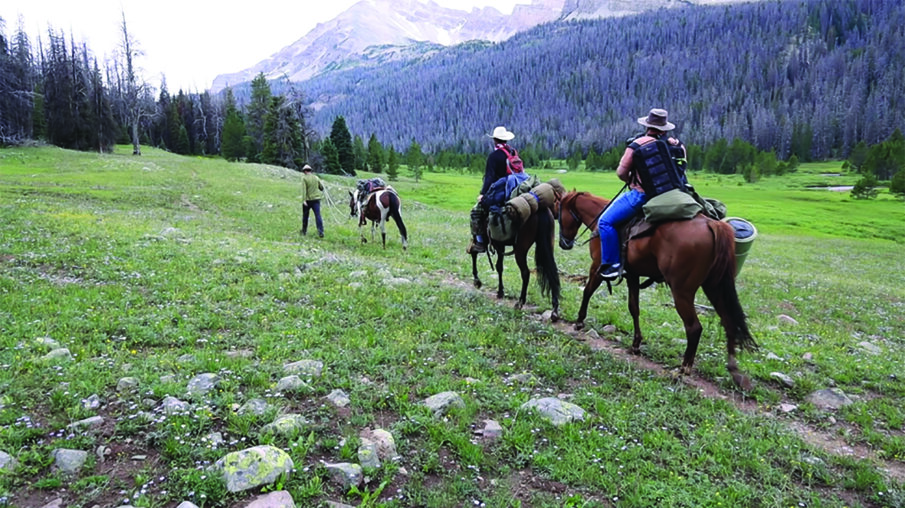 Simmons, Brown, and Ultradent's Martin Webb trek to Dead Horse Lake on horseback.