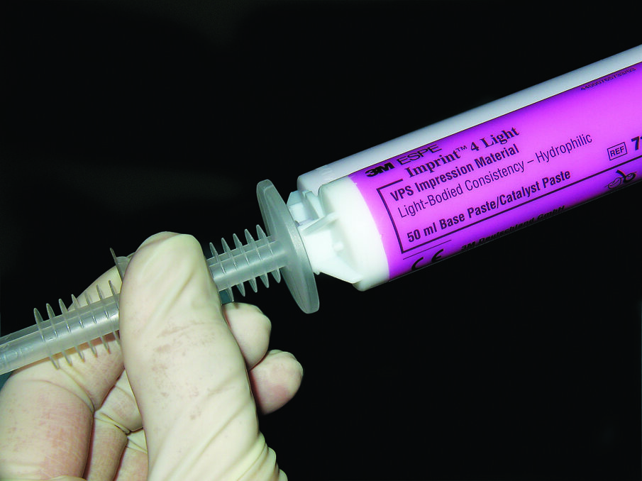 Fig. 5. 3M Intra-oral Syringe connects easily to a cartridge