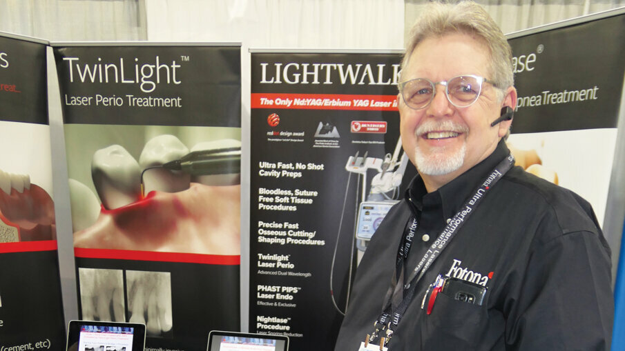 David Williams with the Lightwalker laser at the Fotona booth.