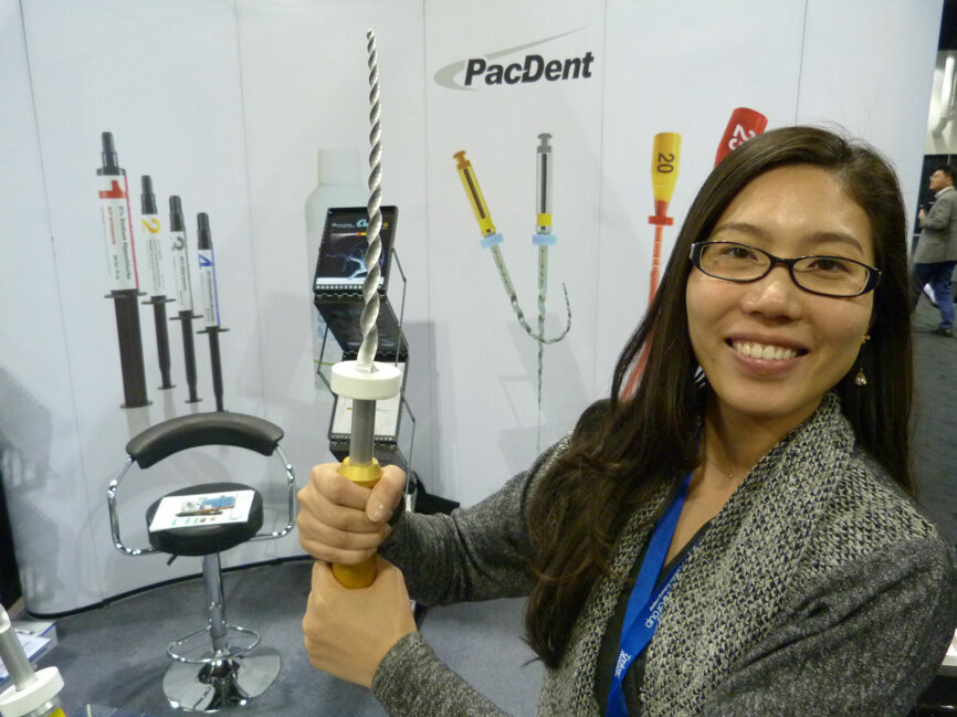 Sara Qu wields a giant rotary file in the PacDent booth.