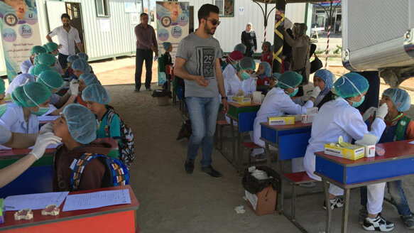 Dental professor travels to Syrian refugee camps, treats more than 1,000 children