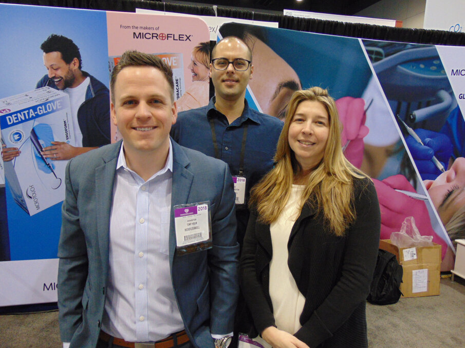 From left: Tony Holm, Michael Livingston and Jennifer Gillespie of Microflex/Ansell. (Photo: Fred Michmershuizen/Dental Tribune America)