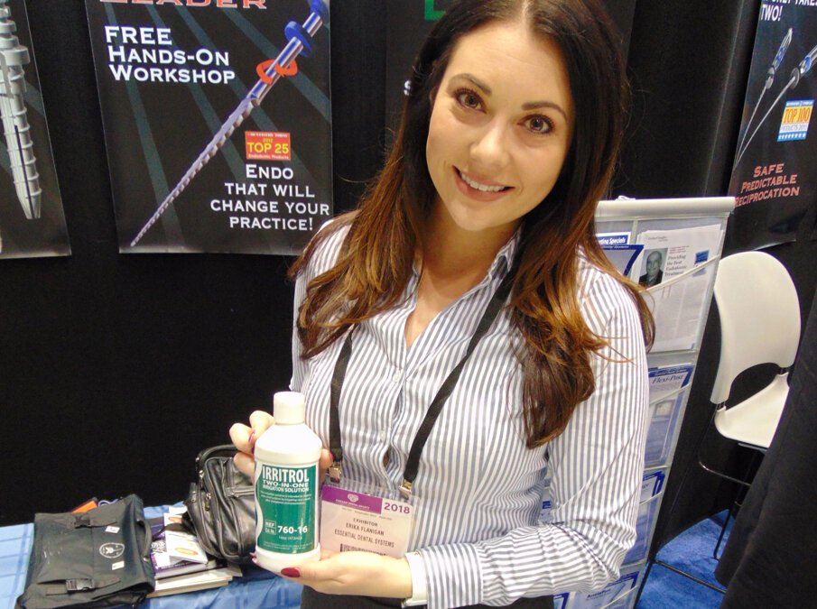 Erika Flanigan of Essential Dental Systems (EDS) holds the award-winning Irritrol two-in-one irrigation solution. (Photo: Fred Michmershuizen/Dental Tribune America)