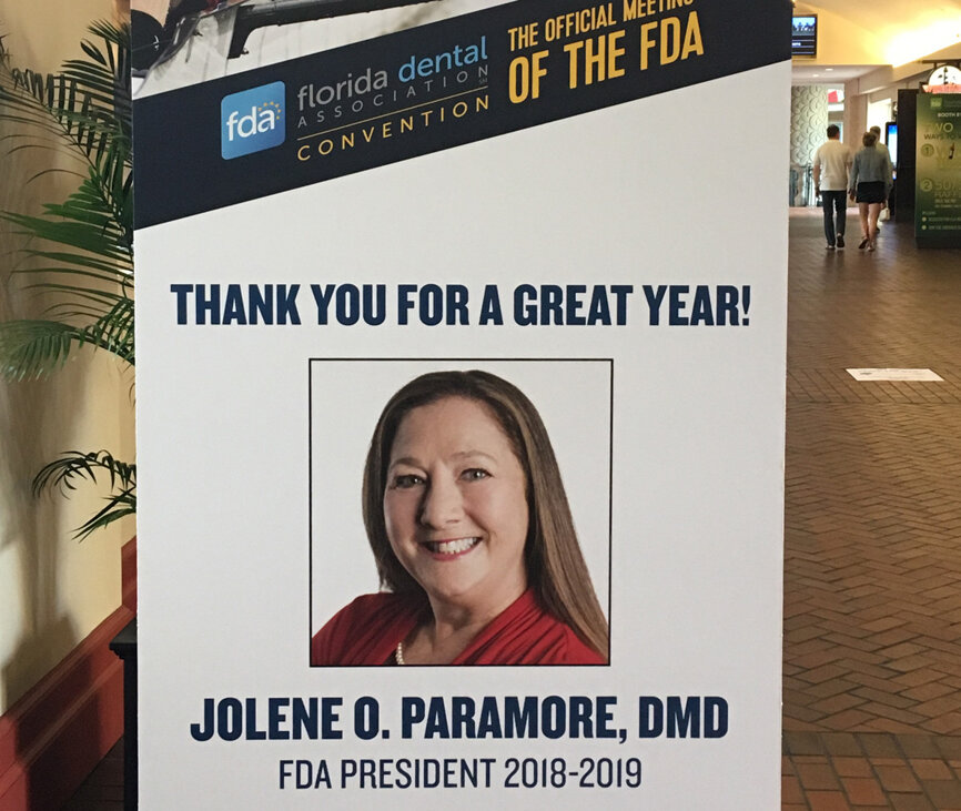 Signs hung around the Gaylord Palms Convention Center congratulate outgoing FDA President Dr. Jolene Paramore on a job well done. Paramore’s term ended with the close of the meeting on Saturday.