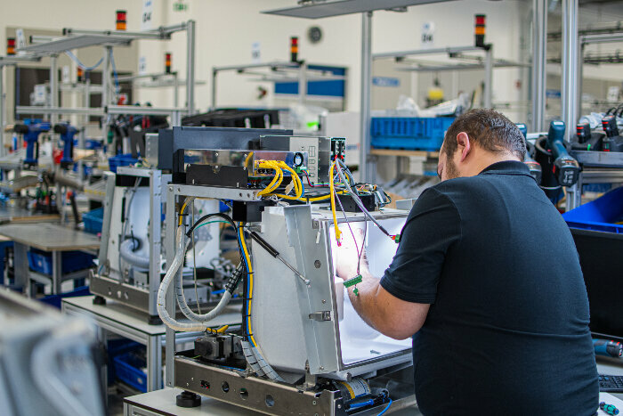 Zirconia blanks, milling machines and digital prosthetics tools are produced at Dentustry One, and a range of machines are assembled. (Image: Amann Girrbach)